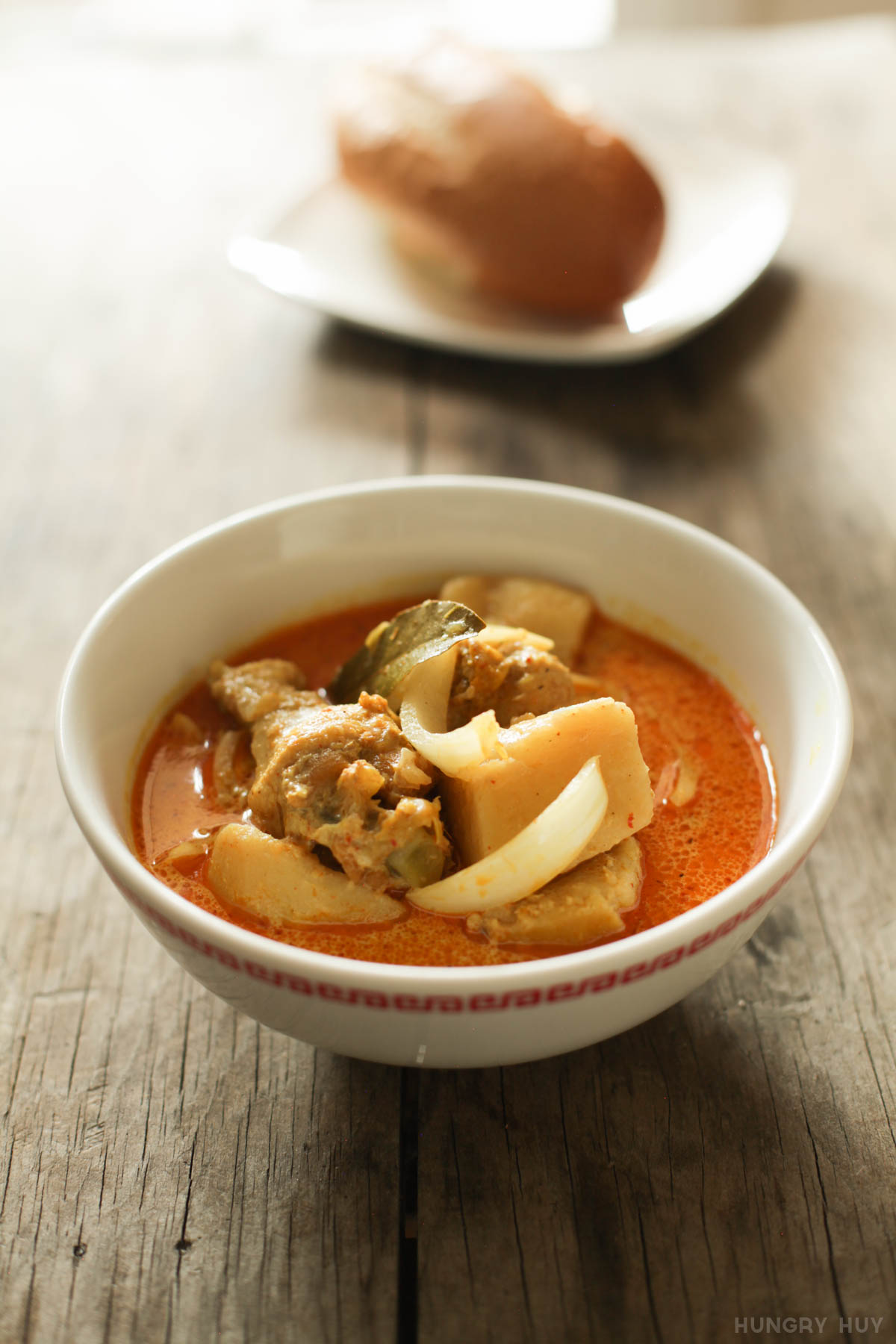 A bowl of Vietnamese chicken curry, with onion and potatoes