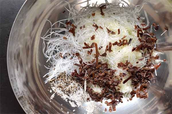 combining filling ingredients in metal bowl