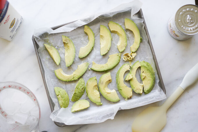 slices of frozen avocado on wax paper