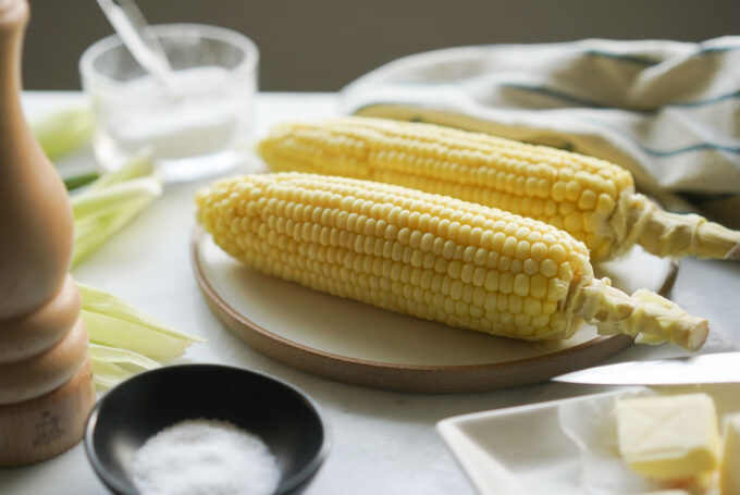 two microwaved corn on the cob