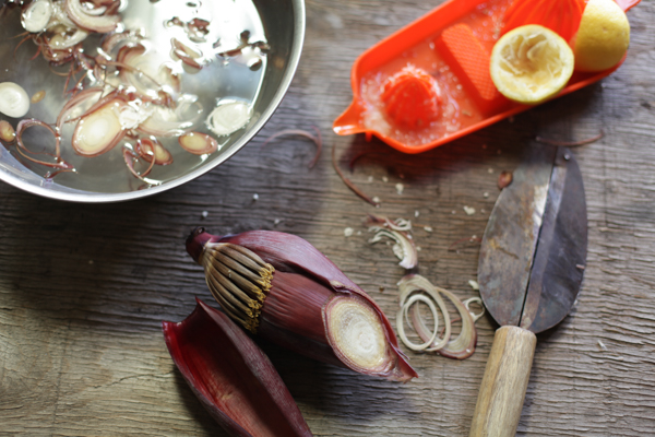 sliced banana flower, sitting in citrus water