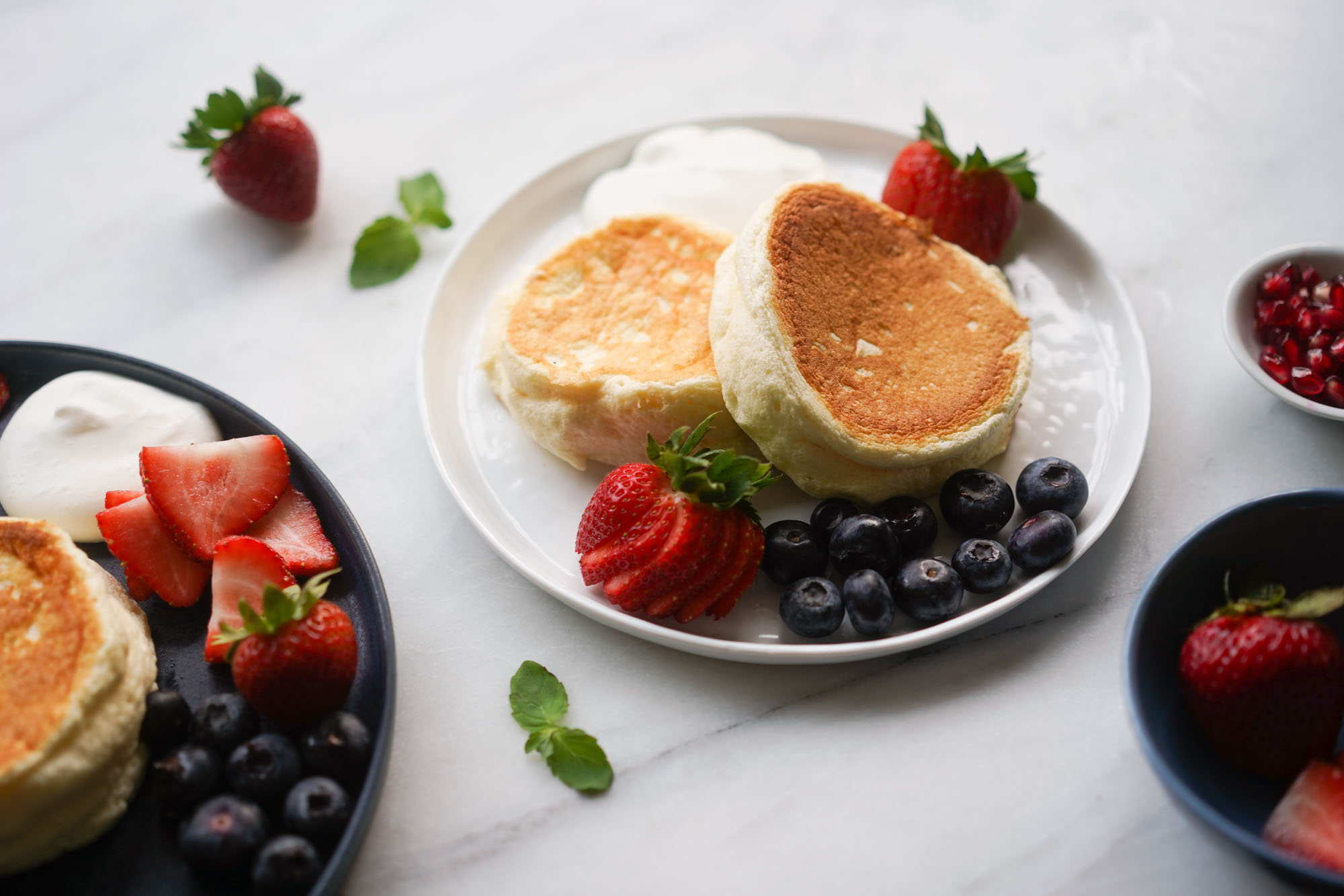 https://www.hungryhuy.com/wp-content/uploads/souffle-pancakes-w-fruit.jpg